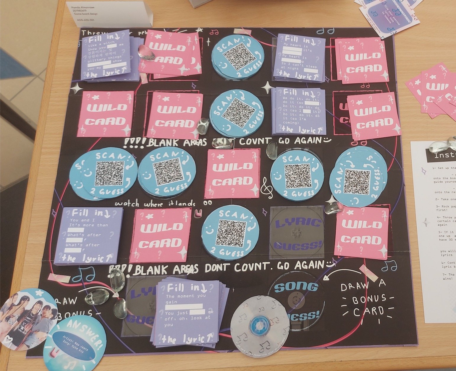 A boardgame based on K-pop Y2K music is displayed on a table in the Atrium on the Dubai campus in May.